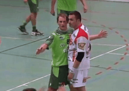 Guy pushes his opponent after he kisses him