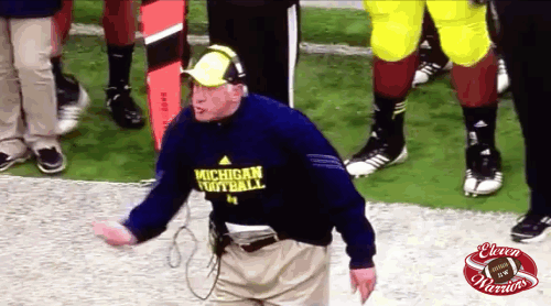 football coach does weird movements with his hands