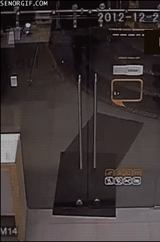 man breaks a door by opening it