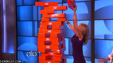Ellen pushes Alison Sweeney onto a Jenga tower causing it to collapse and fall. Alison Sweeney also falls on top of the Jenga pieces.