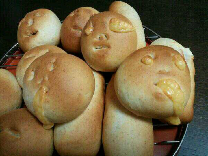 Smiley face dinner buns gone wrong. They were suppose to be smiley faces but turned into abominations.