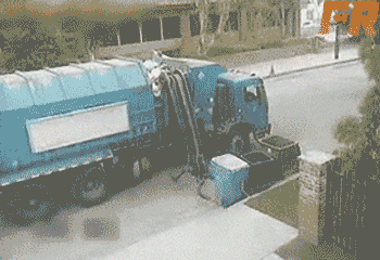 A garbage truck picks up a garbage bin and tries to empty the garbage. Upon trying to put it back down it flings trash everywhere.
