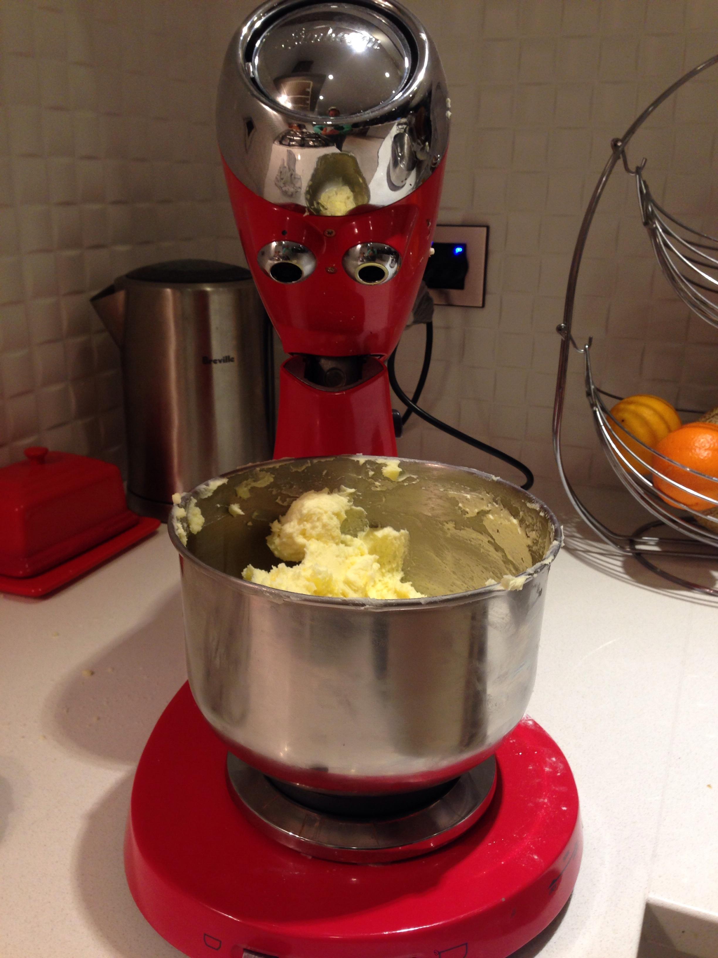 A stand mixer has an expression of despair on its face thinking what have i done