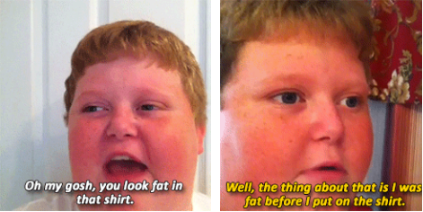 A fat kid responds to looking fat in a shirt by saying he was fat before he put on the shirt.